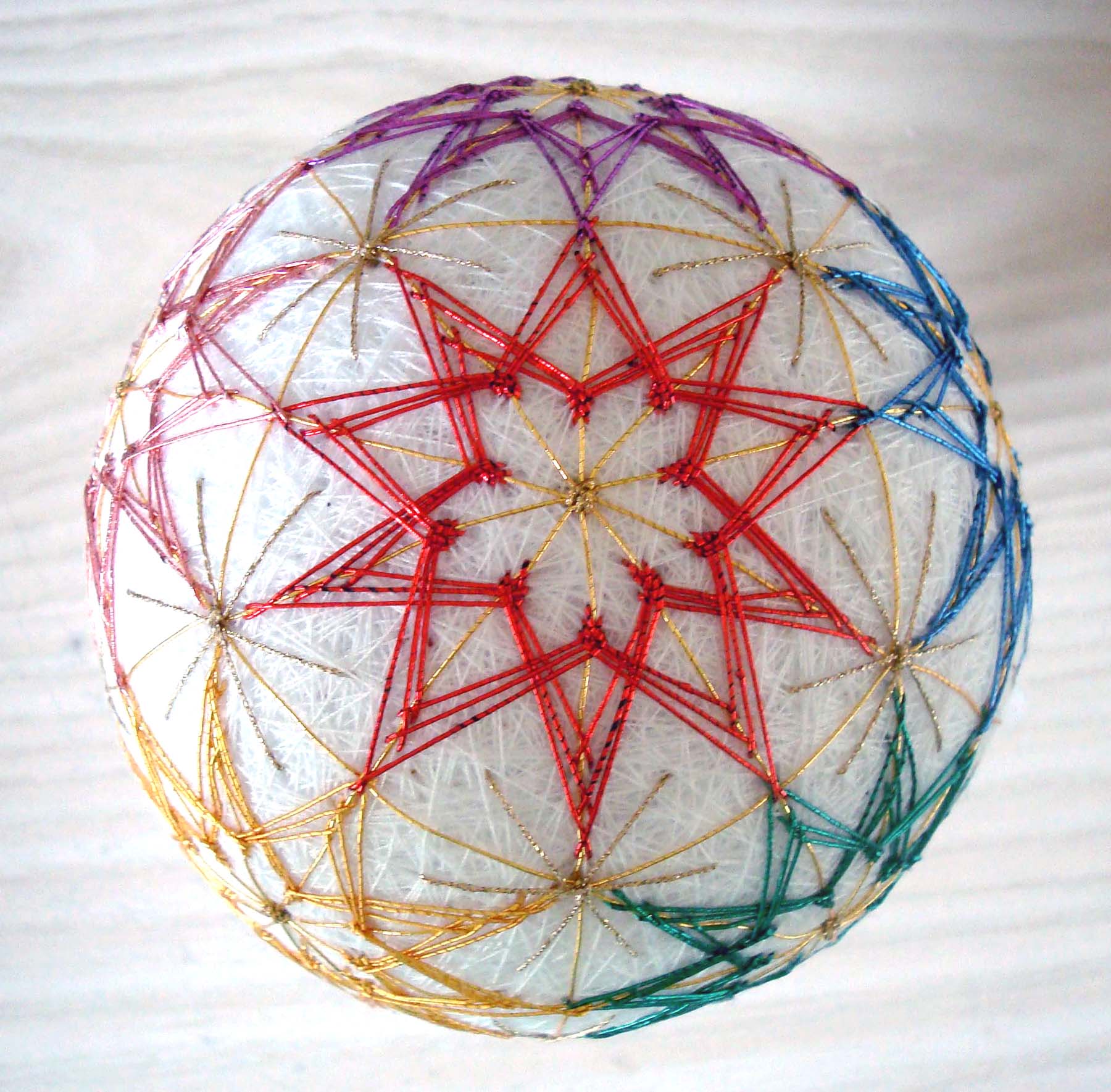 This Temari ball was created for Kreinik when we added Japan #7 thread colors. This specialty wrapped fiber has bright lustre and smooth finish. They are as elegant as they come, see http://www.kreinik.com/shops/Japan-Thread-7-5m-spools.html