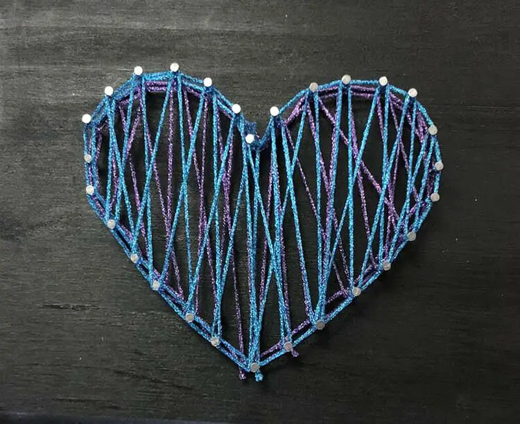 Can you see the layering of fibers in this string art heart? Just imagine the fun you have have with different kinds of threads. This design uses a few Kreinik thread types.