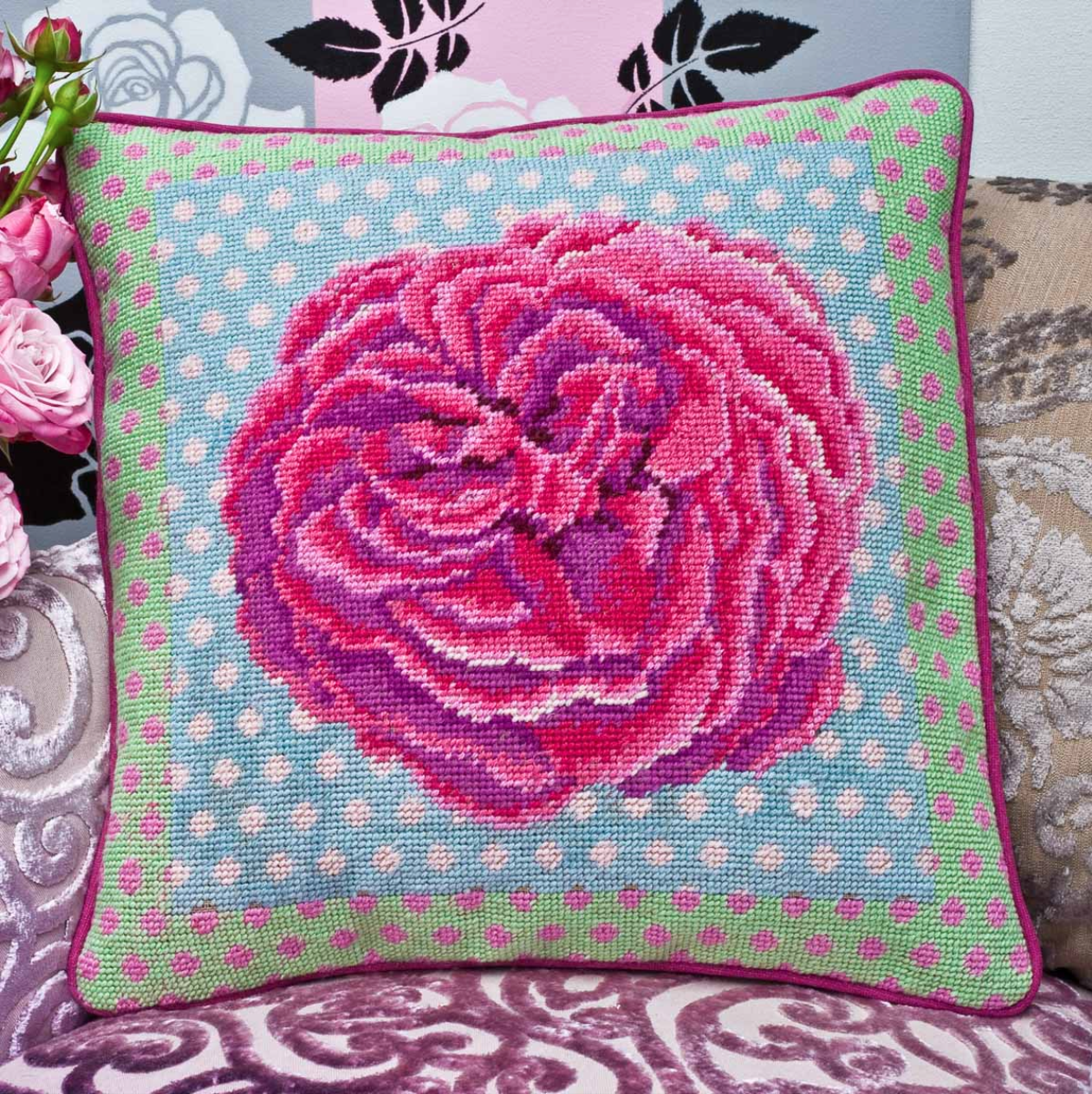 Bright rose bloom needlepoint cushion kit designed by Kaffe Fassett and sold by Erhman Tapestry